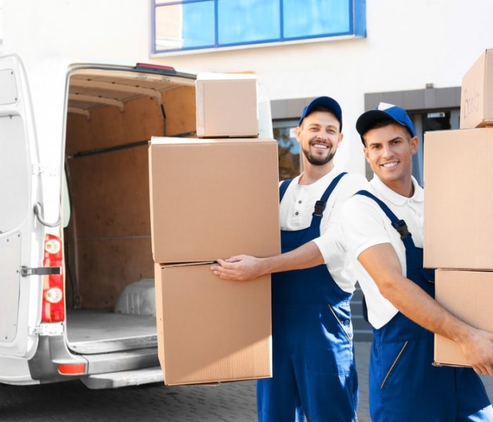 Delivery,Men,With,Moving,Boxes,Near,Car